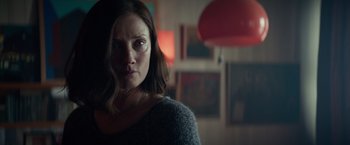 Movie still from “Red Sparrow” (2018), directed by Francis Lawrence – A person in a dark room; Close Up shot, Over the shoulder angle