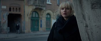 Movie still from “Red Sparrow” (2018), directed by Francis Lawrence – A woman standing on the side of the street; Close Up shot, Over the shoulder angle