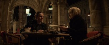 Movie still from “Red Sparrow” (2018), directed by Francis Lawrence – Two people sitting at a table in a restaurant; Medium shot, Over the shoulder angle