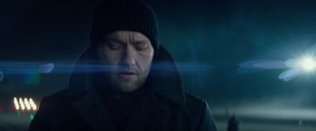 Movie still from “Red Sparrow” (2018), directed by Francis Lawrence – A person wearing a coat and a hat; Close Up shot, Low angle