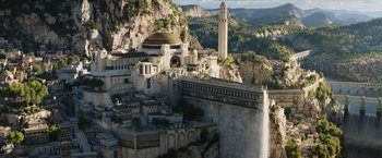 Movie still from “The Lord of the Rings: The Rings of Power” (2022), created by Patrick McKay – A view of a city from a hill; Extreme Wide shot, High angle
