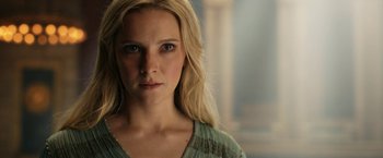 Movie still from “The Lord of the Rings: The Rings of Power” (2022), created by Patrick McKay – A person with long blonde hair; Close Up shot, Low angle