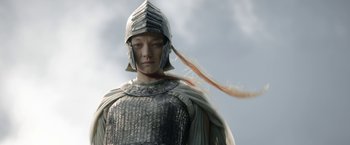 Movie still from “The Lord of the Rings: The Rings of Power” (2022), created by Patrick McKay – A man in a helmet and a chain - mail outfit; Close Up shot, Low angle