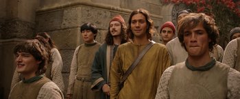 Movie still from “The Lord of the Rings: The Rings of Power” (2022), created by Patrick McKay – A group of men standing next to each other; Medium shot, Low angle