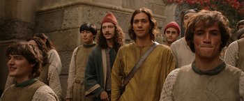 Movie still from “The Lord of the Rings: The Rings of Power” (2022), created by Patrick McKay – A group of men standing next to each other; Medium shot, Low angle