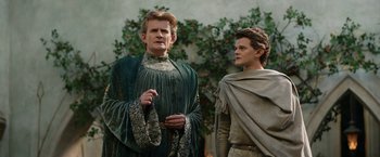 Movie still from “The Lord of the Rings: The Rings of Power” (2022), created by Patrick McKay – A man and a boy standing next to each other; Medium shot, Low angle