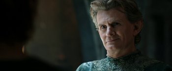 Movie still from “The Lord of the Rings: The Rings of Power” (2022), created by Patrick McKay – A person wearing a green shirt; Close Up shot, Low angle