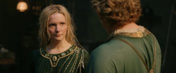 Movie still from “The Lord of the Rings: The Rings of Power” (2022), created by Patrick McKay – A woman looking at a mirror while standing next to another woman; Close Up shot, Over the shoulder angle