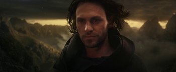 Movie still from “The Lord of the Rings: The Rings of Power” (2022), created by Patrick McKay – A person with long dark hair; Close Up shot, Low angle