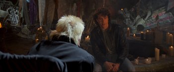 Movie still from “The Lost Boys” (1987), directed by Joel Schumacher – A man sitting next to another man in front of a mirror; Medium shot, Over the shoulder angle