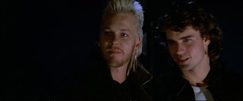 Movie still from “The Lost Boys” (1987), directed by Joel Schumacher – A person wearing a jacket; Close Up shot, Over the shoulder angle