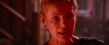 Movie still from “The Lost Boys” (1987), directed by Joel Schumacher – A person with short blonde hair; Close Up shot, Low angle