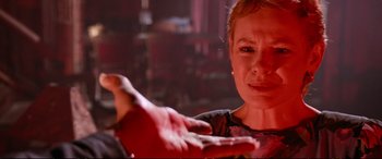 Movie still from “The Lost Boys” (1987), directed by Joel Schumacher – A woman is holding out her hand with blood coming out of it; Close Up shot, Over the shoulder angle