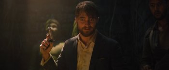 Movie still from “The Lost City” (2022), directed by Aaron Nee – A person holding a cell phone; Close Up shot, Over the shoulder angle