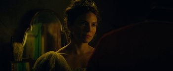Movie still from “The Lost City of Z” (2016), directed by James Gray – A woman with a tiara looking into a mirror in a dark room; Close Up shot, Over the shoulder angle