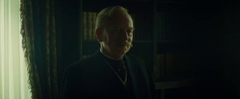 Movie still from “The Lost City of Z” (2016), directed by James Gray – An old man with a beard and mustache in a dark room; Close Up shot, Low angle