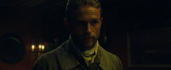 Movie still from “The Lost City of Z” (2016), directed by James Gray – A person with a beard; Close Up shot, Low angle