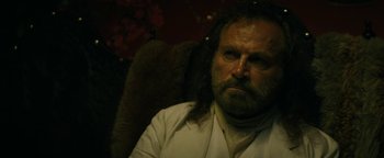 Movie still from “The Lost City of Z” (2016), directed by James Gray – A person sitting in a chair; Close Up shot, Over the shoulder angle