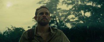 Movie still from “The Lost City of Z” (2016), directed by James Gray – A person wearing a shirt; Close Up shot, Low angle
