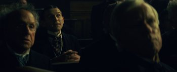 Movie still from “The Lost City of Z” (2016), directed by James Gray – A man sitting at a table in front of another man; Close Up shot, Over the shoulder angle