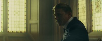 Movie still from “The Lost City of Z” (2016), directed by James Gray – A person wearing a suit and tie; Close Up shot, Over the shoulder angle