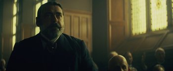 Movie still from “The Lost City of Z” (2016), directed by James Gray – An older man with a beard is sitting in a room; Close Up shot, Low angle