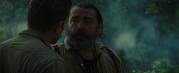 Movie still from “The Lost City of Z” (2016), directed by James Gray – A man with a long gray beard is talking to another man; Close Up shot, Over the shoulder angle