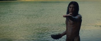 Movie still from “The Lost City of Z” (2016), directed by James Gray – A shirtless man standing in a body of water; Medium shot, Low angle