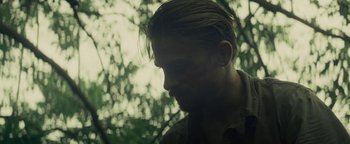 Movie still from “The Lost City of Z” (2016), directed by James Gray – A person with a beard; Close Up shot, Over the shoulder angle
