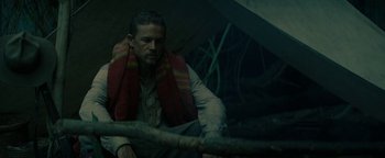 Movie still from “The Lost City of Z” (2016), directed by James Gray – A man with a red towel around his neck; Medium shot, Low angle