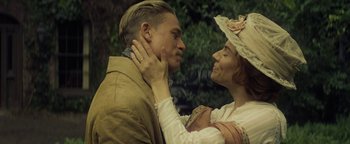 Movie still from “The Lost City of Z” (2016), directed by James Gray – A man and a woman are standing next to each other; Close Up shot, Low angle