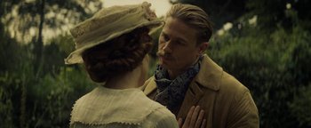 Movie still from “The Lost City of Z” (2016), directed by James Gray – A man and a woman standing next to each other; Close Up shot, Over the shoulder angle