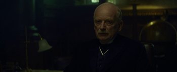 Movie still from “The Lost City of Z” (2016), directed by James Gray – An old man with a goatee is wearing a suit; Close Up shot, Low angle