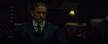 Movie still from “The Lost City of Z” (2016), directed by James Gray – A person wearing a suit and tie; Close Up shot, Over the shoulder angle