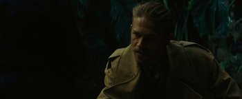 Movie still from “The Lost City of Z” (2016), directed by James Gray – A person wearing a trench coat; Close Up shot, Over the shoulder angle