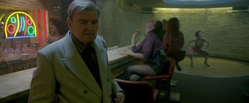Movie still from “The Lure” (2015), directed by Agnieszka Smoczynska – An older man standing in front of a woman; Medium shot, Over the shoulder angle