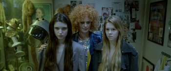 Movie still from “The Lure” (2015), directed by Agnieszka Smoczynska – A group of young women standing next to each other in a room; Close Up shot, High angle
