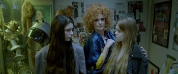 Movie still from “The Lure” (2015), directed by Agnieszka Smoczynska – A group of women standing next to each other in a room; Medium shot, Over the shoulder angle