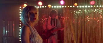 Movie still from “The Lure” (2015), directed by Agnieszka Smoczynska – A man and a woman are playing guitar in a club; Medium shot, Over the shoulder angle