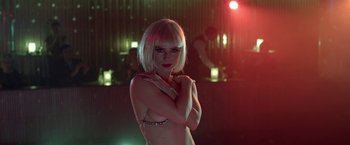 Movie still from “The Lure” (2015), directed by Agnieszka Smoczynska – A woman in a bra is posing for a picture; Close Up shot, Over the shoulder angle