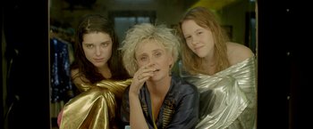Movie still from “The Lure” (2015), directed by Agnieszka Smoczynska – A group of women sitting next to each other; Close Up shot, Overhead angle