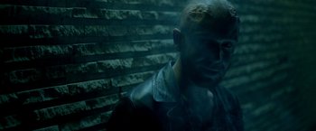 Movie still from “The Lure” (2015), directed by Agnieszka Smoczynska – A man in a leather jacket is looking at the camera; Close Up shot, Over the shoulder angle