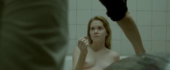 Movie still from “The Lure” (2015), directed by Agnieszka Smoczynska – A woman sitting in front of a mirror in a bath tub; Close Up shot, Over the shoulder angle