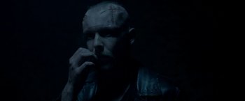 Movie still from “The Lure” (2015), directed by Agnieszka Smoczynska – A man in a leather jacket is smoking a cigarette; Close Up shot, Low angle