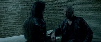 Movie still from “The Lure” (2015), directed by Agnieszka Smoczynska – A man and a woman talking to each other; Medium shot, Over the shoulder angle