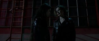 Movie still from “The Lure” (2015), directed by Agnieszka Smoczynska – Two women in leather jackets talking to each other; Medium shot, Over the shoulder angle