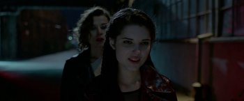 Movie still from “The Lure” (2015), directed by Agnieszka Smoczynska – Two women in leather jackets standing next to each other; Close Up shot, Over the shoulder angle