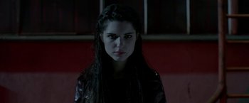 Movie still from “The Lure” (2015), directed by Agnieszka Smoczynska – A woman with long black hair wearing a leather jacket; Close Up shot, Low angle