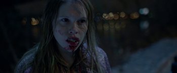 Movie still from “The Lure” (2015), directed by Agnieszka Smoczynska – A young girl with blood on her face; Close Up shot, Over the shoulder angle