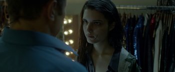 Movie still from “The Lure” (2015), directed by Agnieszka Smoczynska – A woman with long dark hair looking at a man with long dark hair in front of a mirror; Close Up shot, Over the shoulder angle